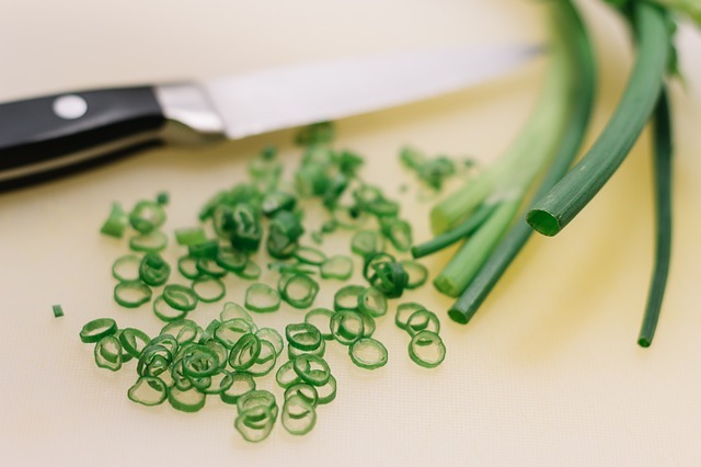 chopped green onions on a table