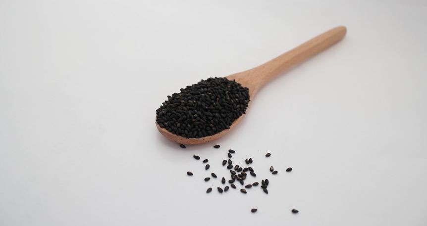 wooden spoon, black sesame seeds