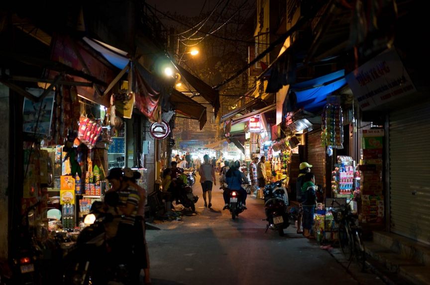 Vietnam street market at night, people, people riding motorcycles