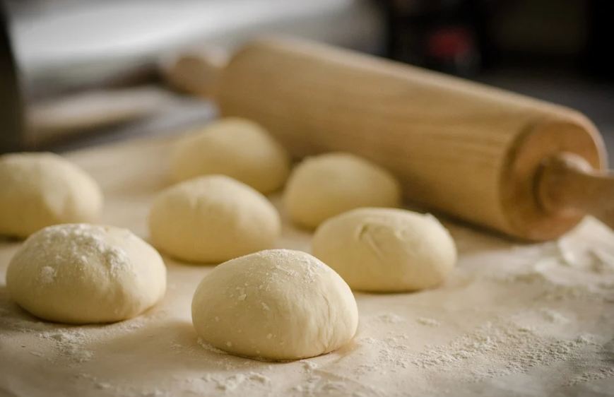 dough, flour, wooden board, rolling pin