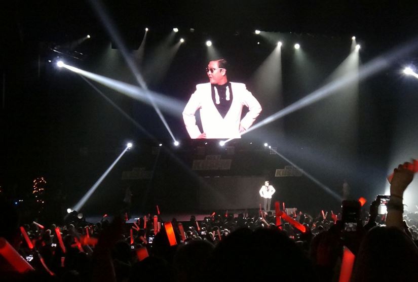 Psy, performing "Gangnam Style" in December 2012 which was the first K-pop to reach more than a billion YouTube views