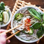 Vietnamese pho with spicy sriracha sauce